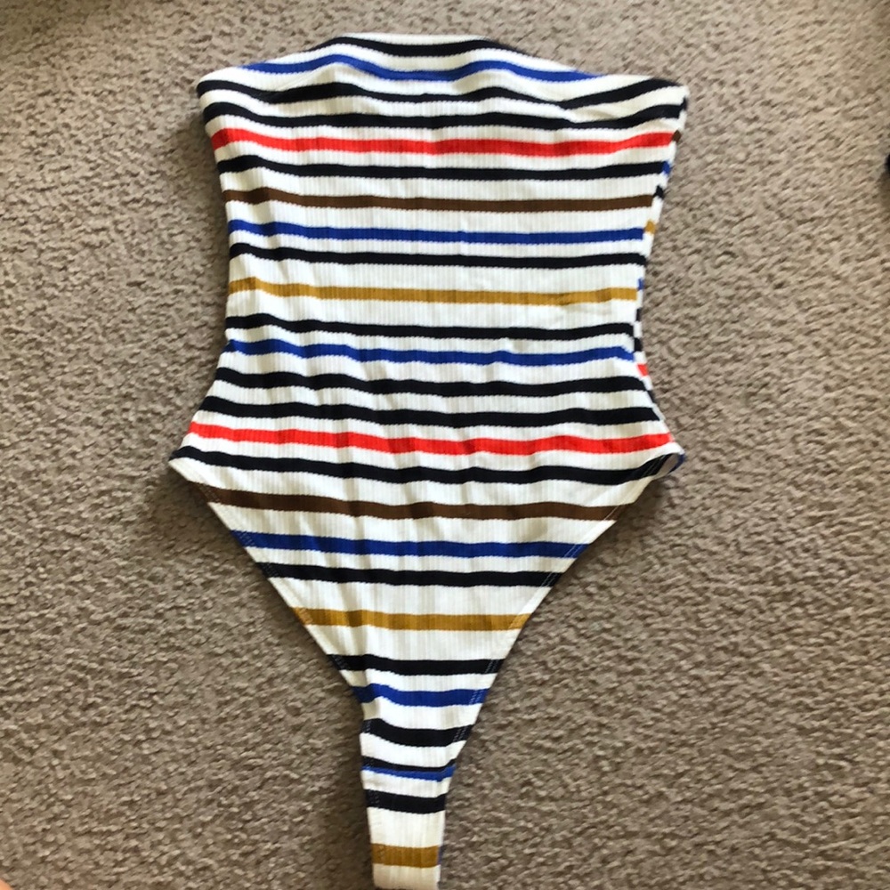 black, white, yellow, red, blue, brown bodysuit.